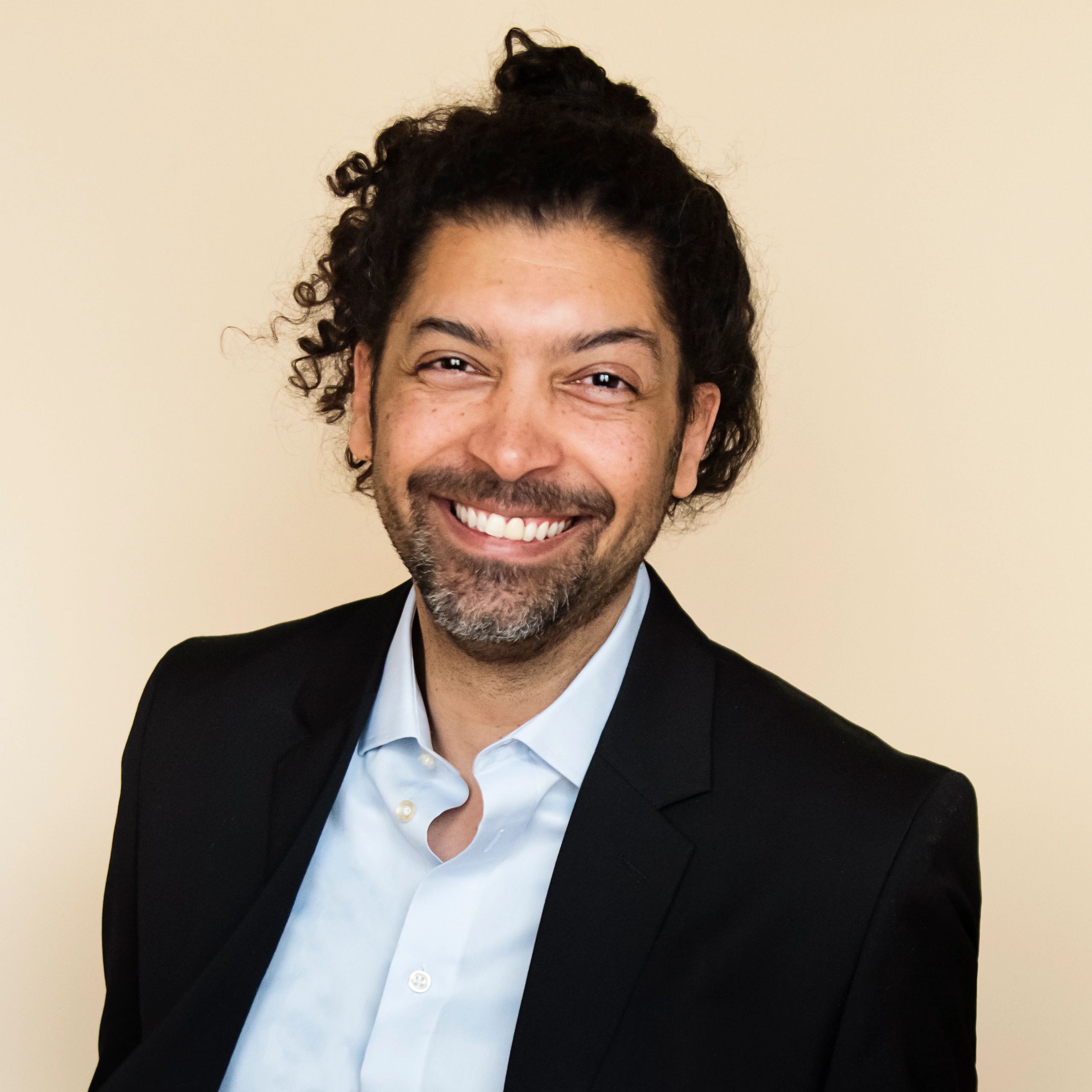Professional portrait representing commercial leadership